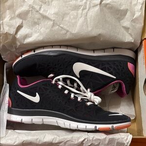 Nike Women's Black and White Athletic Shoes with Pink Accents